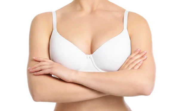Young woman with beautiful breast on white background, closeup