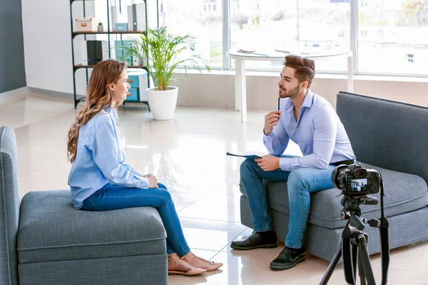 Human resources manager interviewing woman in office