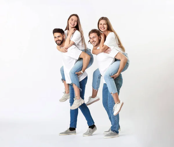 Stylish young people in jeans on white background — Stock Photo, Image