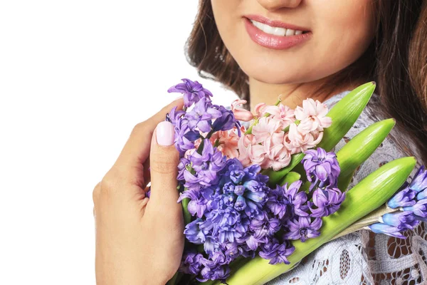 Beautiful young woman with hyacinth flowers on white background, closeup — Stock Photo, Image