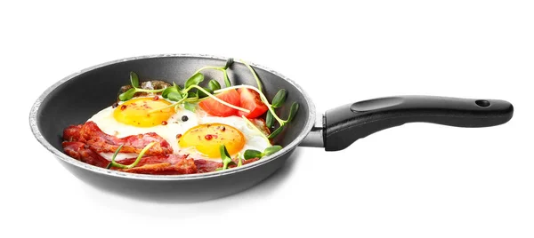 Frying pan with tasty eggs, bacon and tomato on white background — Stock Photo, Image