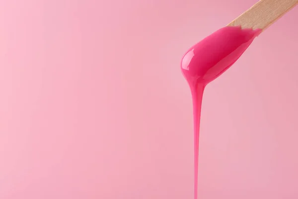 Stick with sugaring paste on color background — Stock Photo, Image