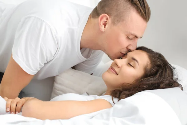 Adorable loving couple in bedroom — Stock Photo, Image