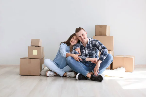 Adorable loving couple after moving into new house — Stock Photo, Image