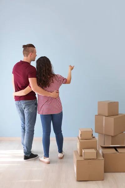 Adorable loving couple after moving into new house — Stock Photo, Image