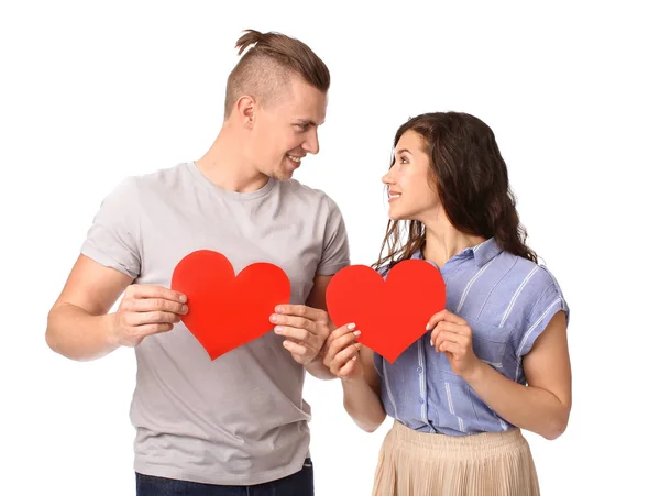 Adorable loving couple with paper hearts on white background — Stock Photo, Image