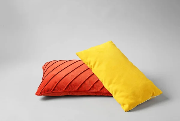 Stylish pillows on grey background — Stock Photo, Image