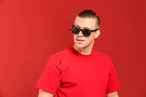 Cool young man on color background — Stock Photo, Image