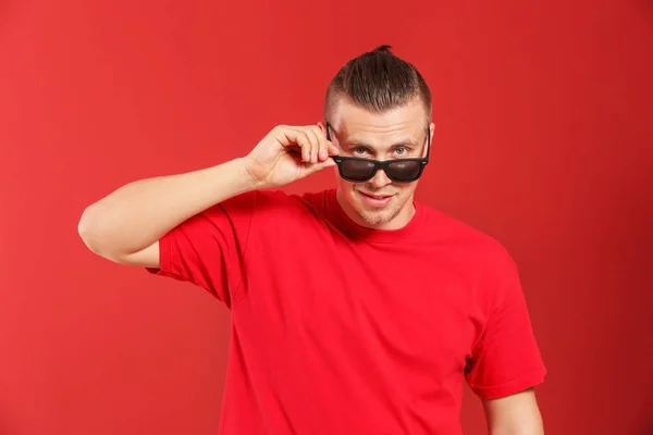 Cool young man on color background — Stock Photo, Image