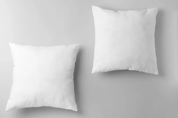 Soft pillows on light background — Stock Photo, Image
