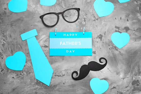 Glasses, paper decor and card with text HAPPY FATHER'S DAY on grunge background — Stock Photo, Image