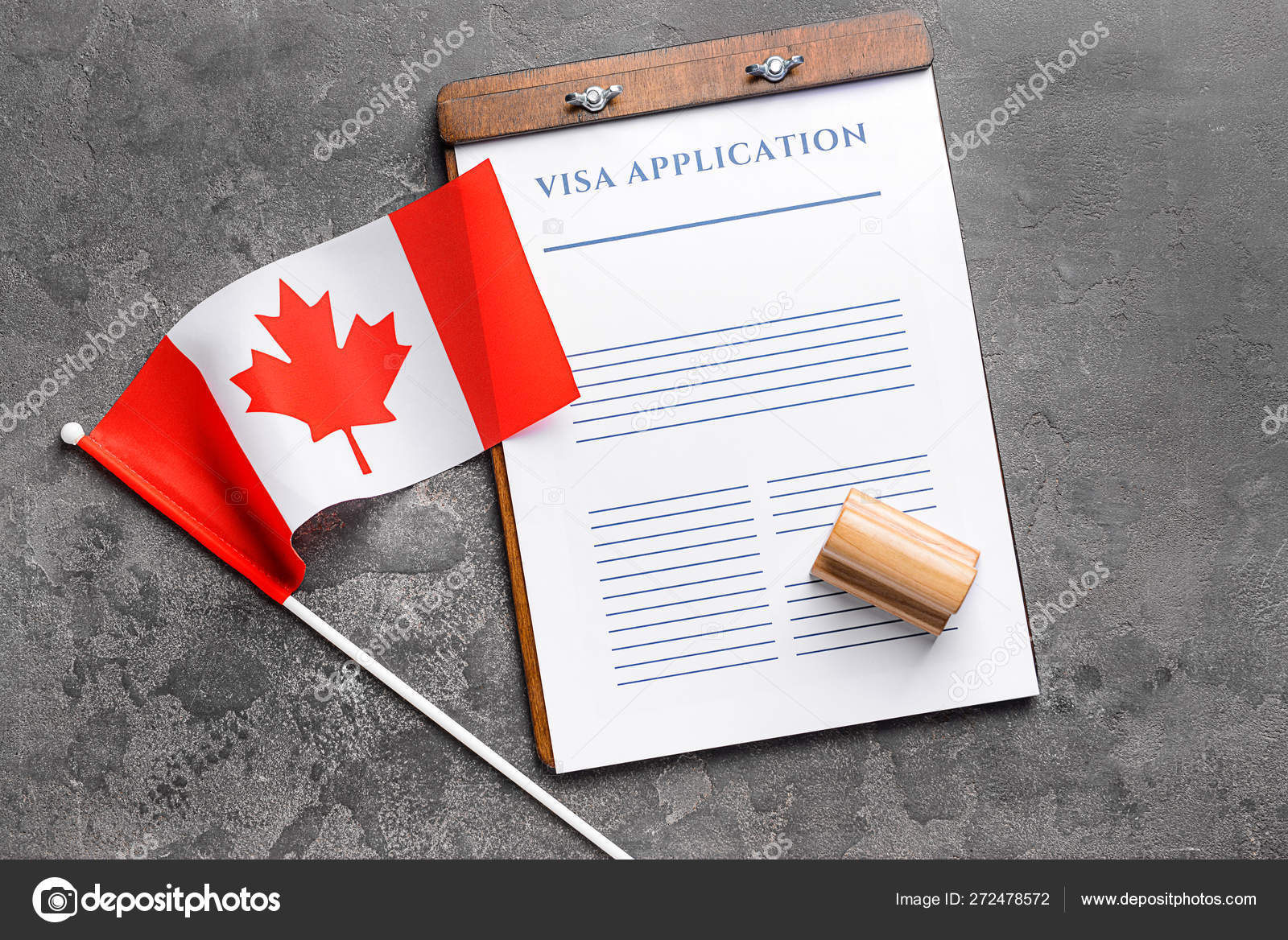 Visa Application Form Stamp And Canadian Flag On Table Concept Of