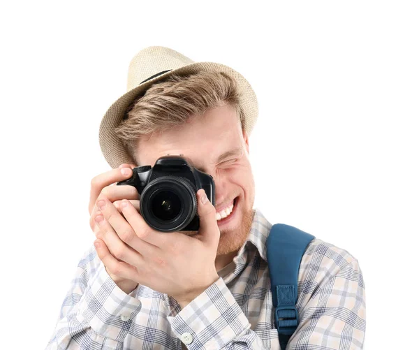 Jonge toerist met fotocamera op witte achtergrond — Stockfoto