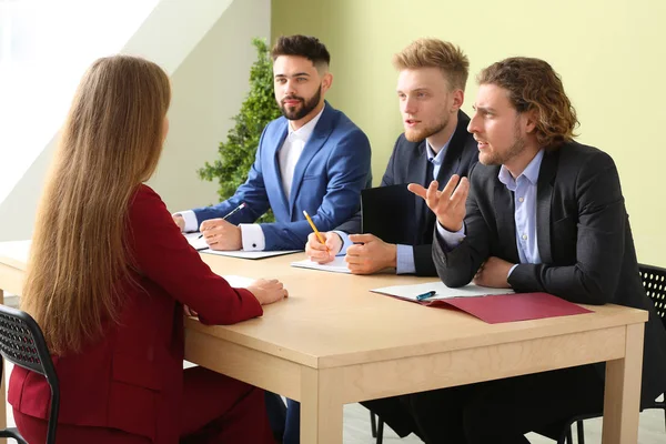 Human resources commission interviewing woman in office