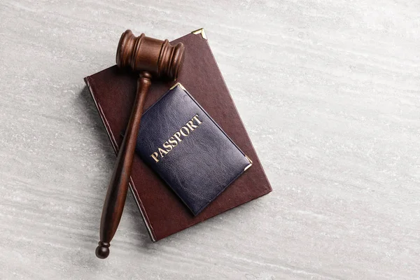 Judge's gavel, book and passport on table. Immigration law concept — Stock Photo, Image