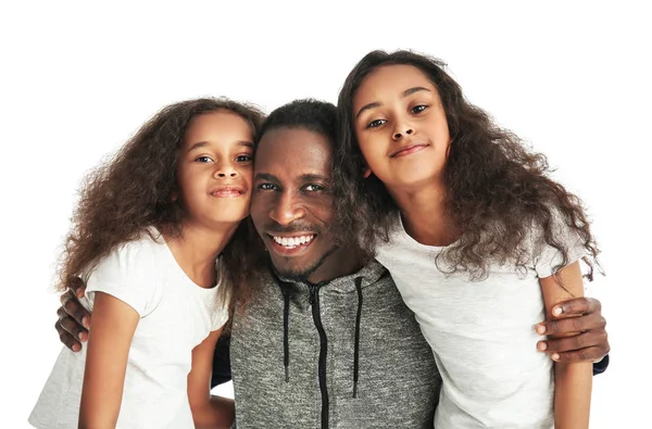 Cute African-American girls with their father on white background — Stock Photo, Image