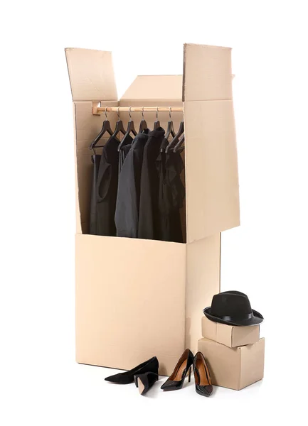 Wardrobe boxes with clothes and shoes on white background — Stock Photo, Image
