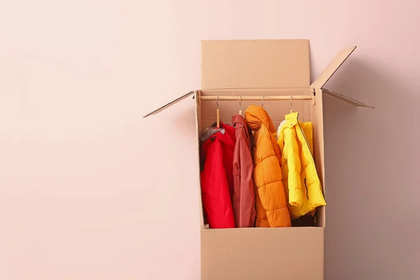 Wardrobe box with clothes on white background — Stock Photo, Image