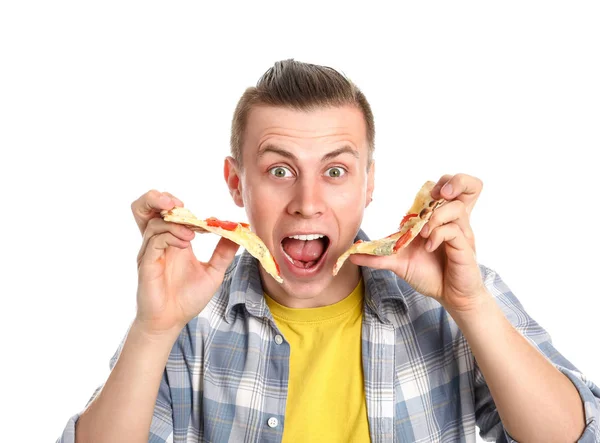 Schöner Mann isst leckere Pizza auf weißem Hintergrund — Stockfoto