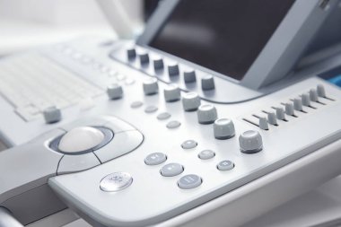 Modern ultrasound equipment in clinic, closeup clipart