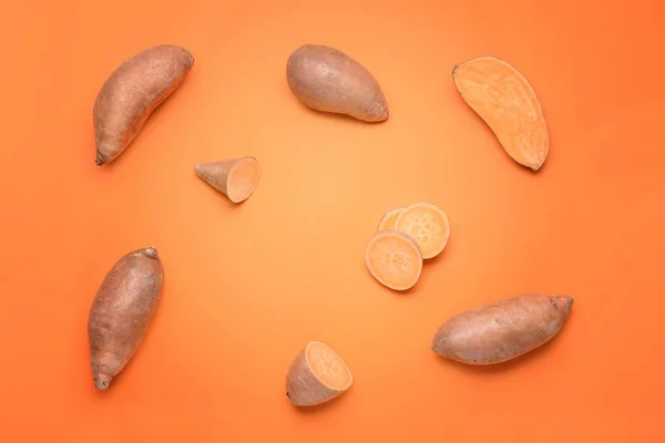 Fresh sweet potatoes on color background — Stock Photo, Image