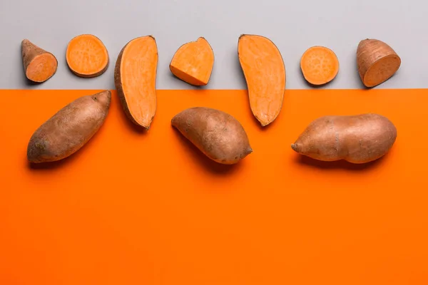 Fresh sweet potatoes on color background — Stock Photo, Image