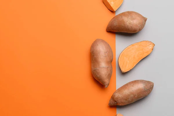 Fresh sweet potatoes on color background — Stock Photo, Image