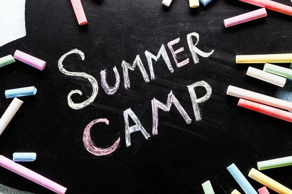 Chalkboard with text SUMMER CAMP, closeup