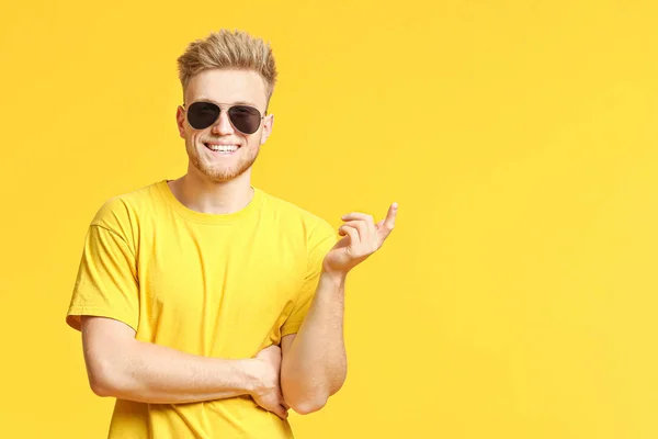 Portrait of handsome young man on color background — Stock Photo, Image