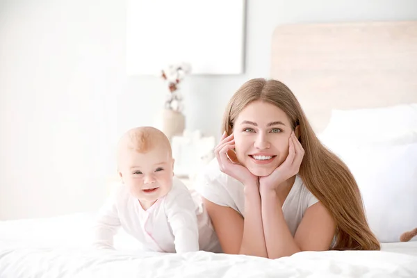 Happy mother with cute little baby at home — Stock Photo, Image