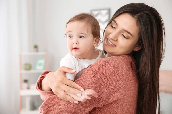 Happy mother with cute little baby at home — Stock Photo, Image