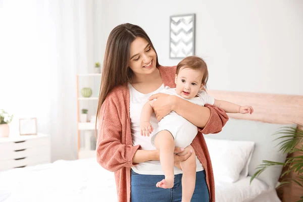 Happy mother with cute little baby at home — Stock Photo, Image