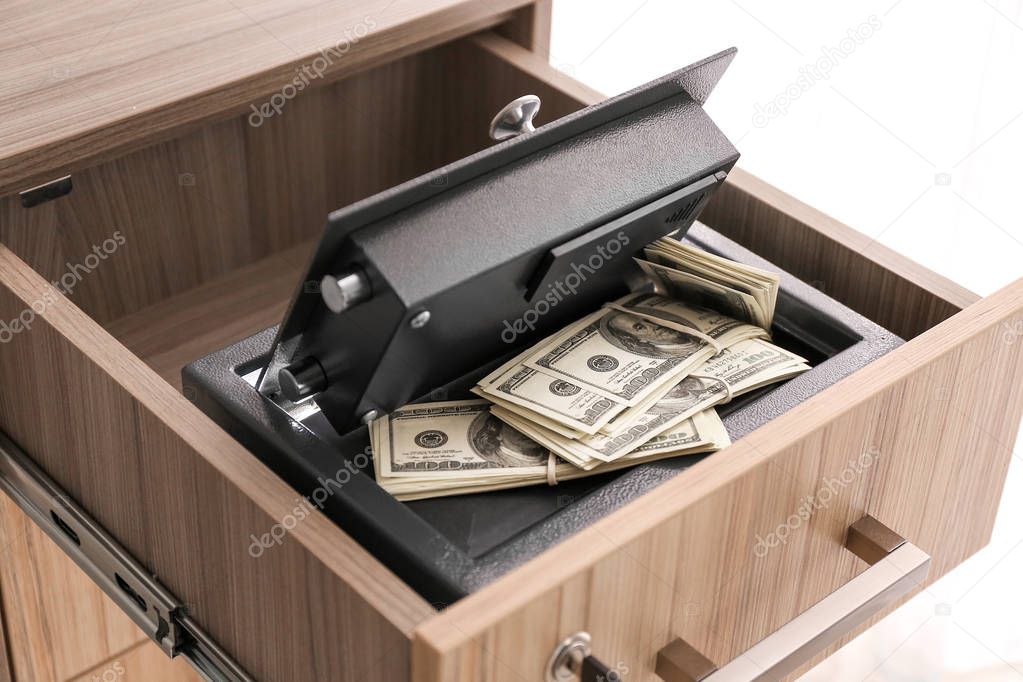 Modern safe with money in drawer
