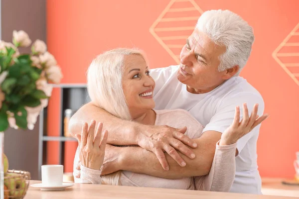 Portrait of happy mature couple at home — Stock Photo, Image