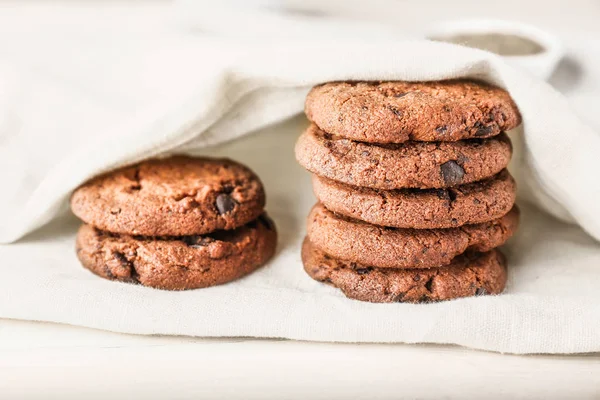 Tasty chocolate cookies on light table — Stock Photo, Image
