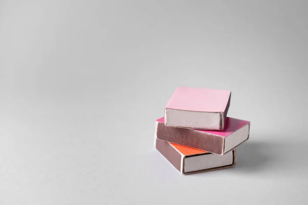 Boxes with matches on light background