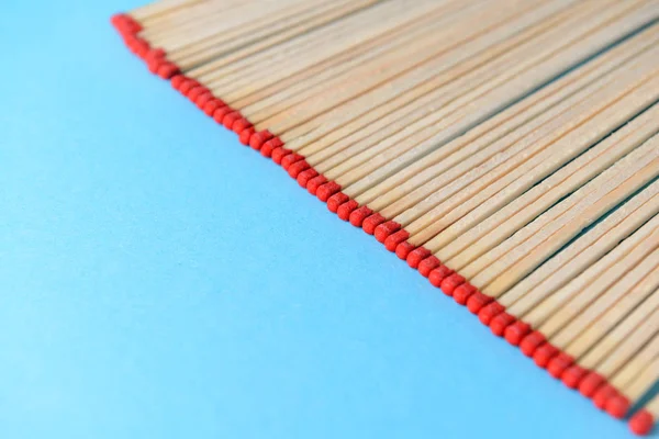 Many matches on color background — Stock Photo, Image