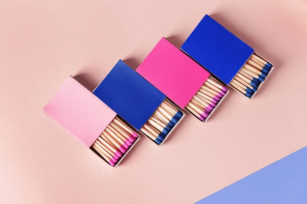 Boxes with matches on color background — Stock Photo, Image