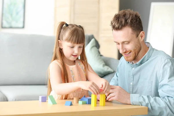 Portrait of happy father and his little daughter playing at home — Stock Photo, Image