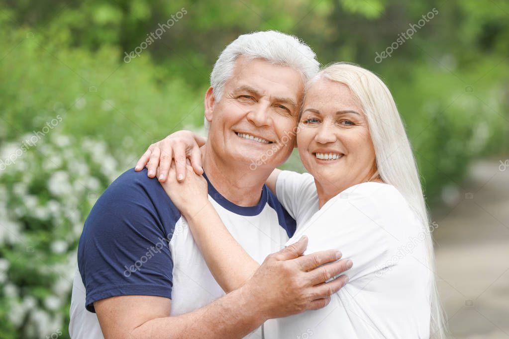 Portrait of happy mature couple in park