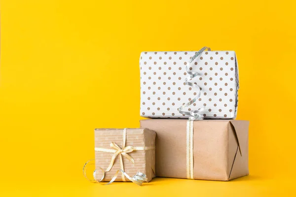 Beautiful gift boxes on color background — Stock Photo, Image