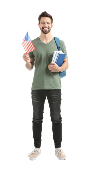 Estudante masculino com bandeira dos EUA em fundo branco — Fotografia de Stock