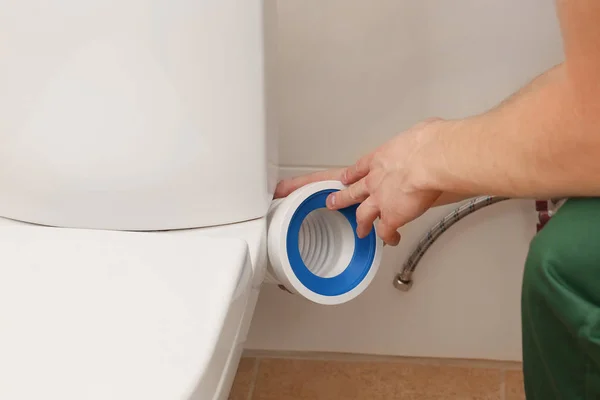 Plumber working in restroom, closeup — Stock Photo, Image