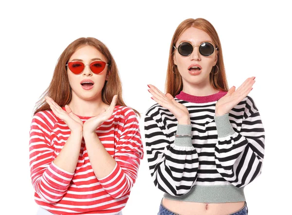 Portrait of shocked young women on white background — Stock Photo, Image