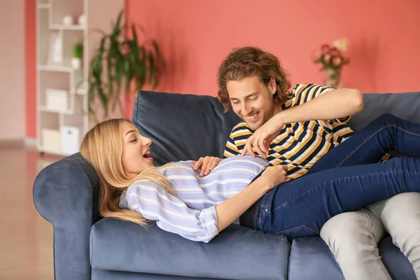 Happy young pregnant couple at home — Stock Photo, Image