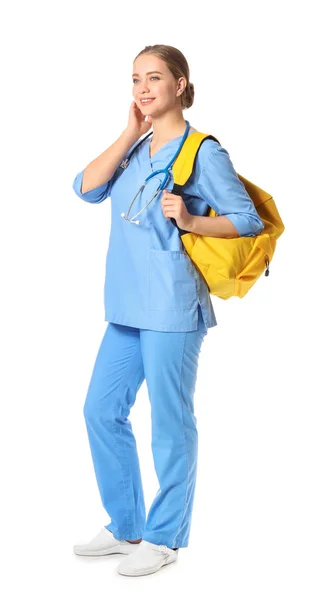 Young medical assistant with backpack on white background — Stock Photo, Image