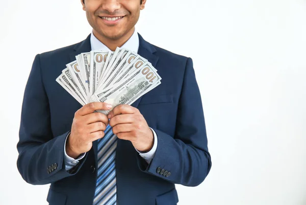 Hombre de negocios guapo con dinero sobre fondo blanco — Foto de Stock