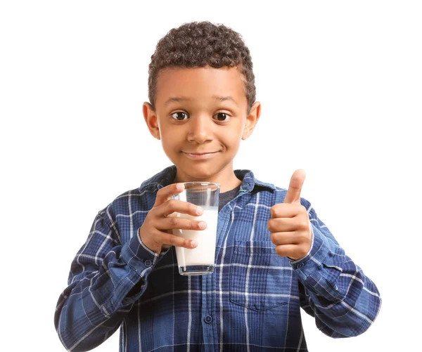 Cute African-American boy with glass of milk showing thumb-up on white background — Stock Photo, Image