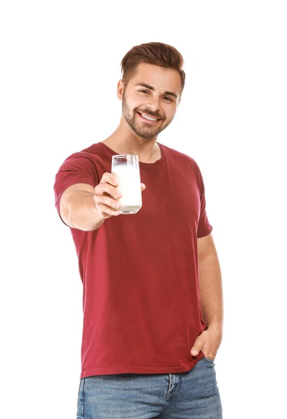 Homem bonito com copo de leite saboroso no fundo branco — Fotografia de Stock