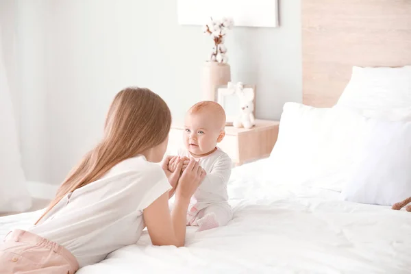 Happy mother with cute little baby at home — Stock Photo, Image